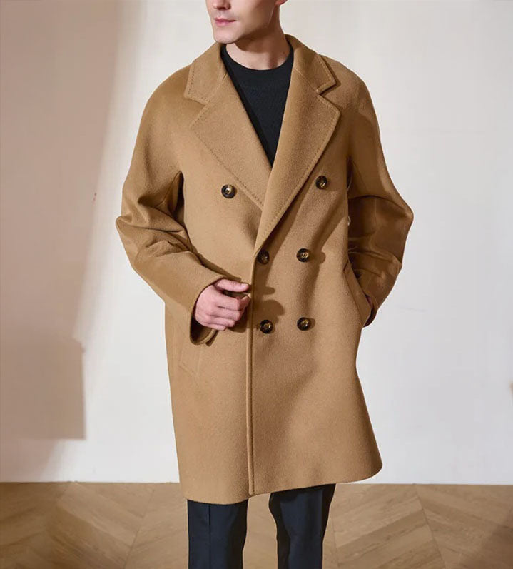 Men’s Double-Breasted Cashmere Coat in Light Taupe, crafted from a luxurious blend of cashmere and high-count wool. Featuring a fluid silhouette, integrated sleeve construction, and a refined six-button front closure. From Borcelleclothes.