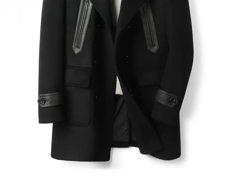 Front lower section of Onyx wool-cashmere coat showing leather-trimmed details. From Borcelleclothes.