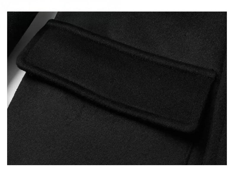 Close-up of Onyx wool-cashmere coat patch pocket with flap. From Borcelleclothes.