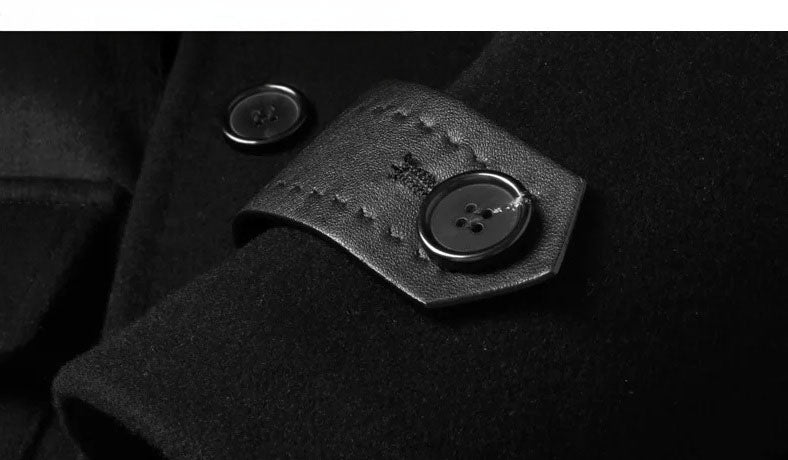 Detail of Onyx wool-cashmere coat sleeve with leather tab and button. From Borcellelothes.