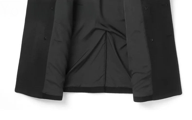 Lower front view of Onyx wool-cashmere coat with sides unfolded to reveal interior finish. From Borcelleclothes.