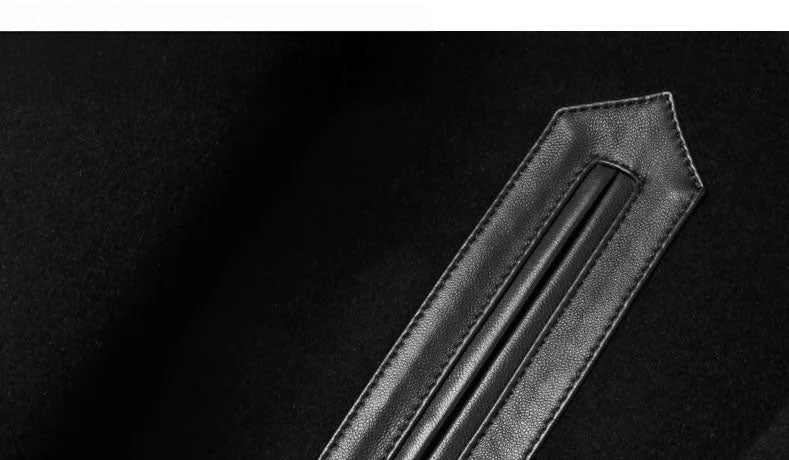 Close-up of leather-trimmed zipper pocket on Onyx wool-cashmere coat. From Borcelleclothes.