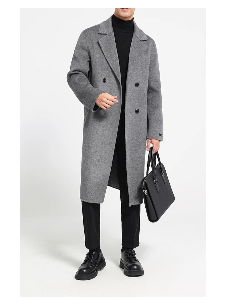 Men’s double-faced wool coat in Concord, double-breasted, with notch lapels—model holding black bag. From Borcelleclothes.