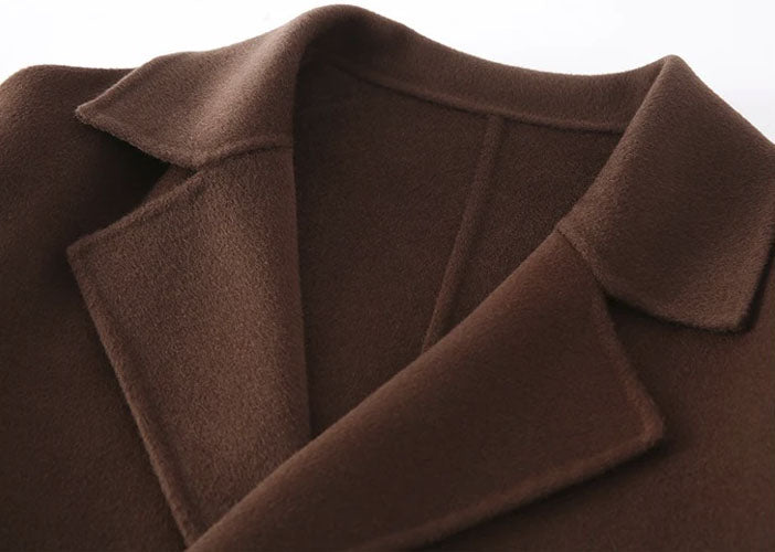 Espresso double-faced wool coat collar with notch lapels, hand-finished edges visible. From Borcelleclothes.