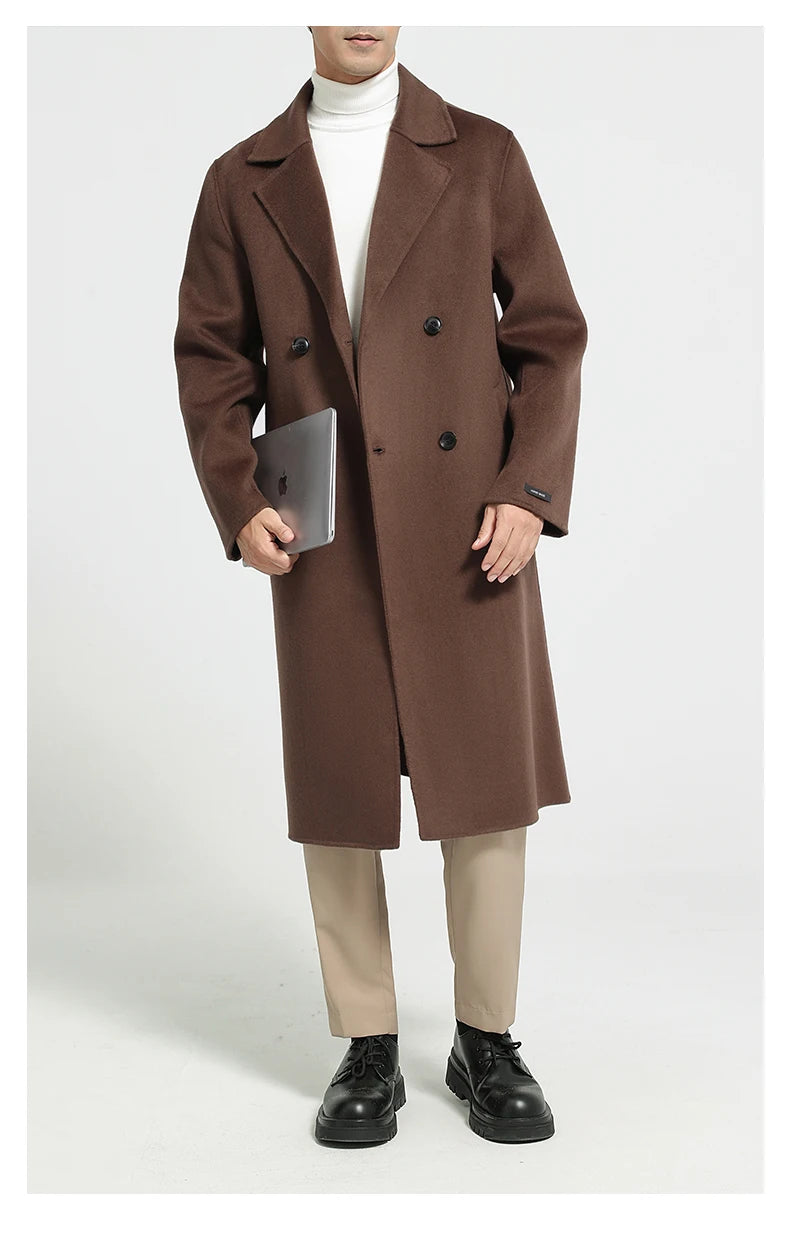 Men’s double-faced wool coat in Espresso, double-breasted, with notch lapels—model holding a notebook. From Borcelleclothes.