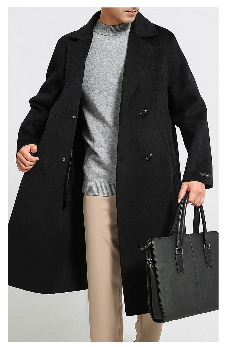 Onyx double-faced wool coat, model holding black bag. From Borcelleclothes.