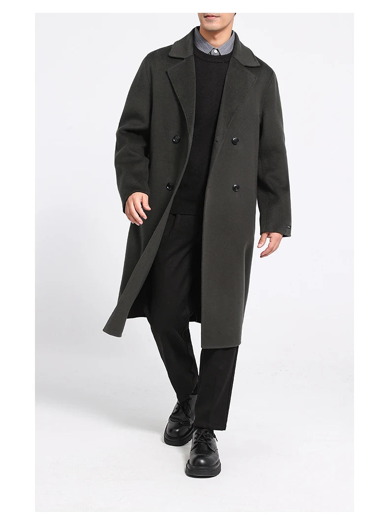 Men’s double-faced wool coat in Tuatara, double-breasted, with notch lapels—model in motion. From Borcelleclothes.
