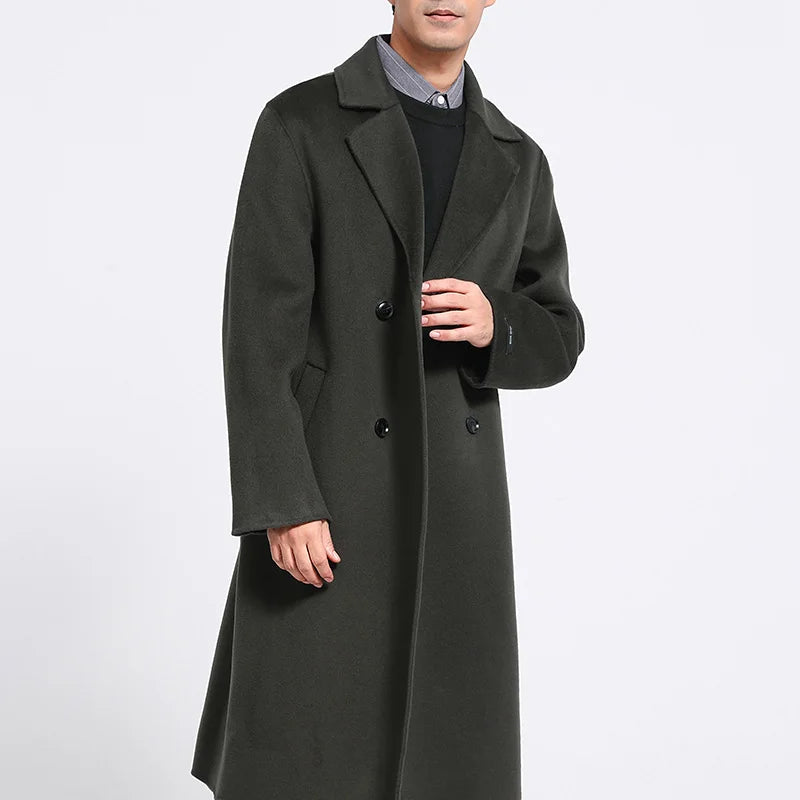 Men’s double-faced wool coat in Tuatara with notch lapels, double-breasted front, and hand-finished seams—crafted for quiet strength and lasting warmth. From Borcelleclothes.