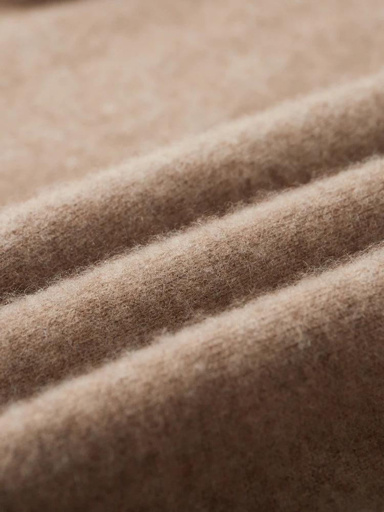 Wave-folded texture of the double-knit cashmere sweater in Beigewood, showing structure and depth — From Borcelleclothes.