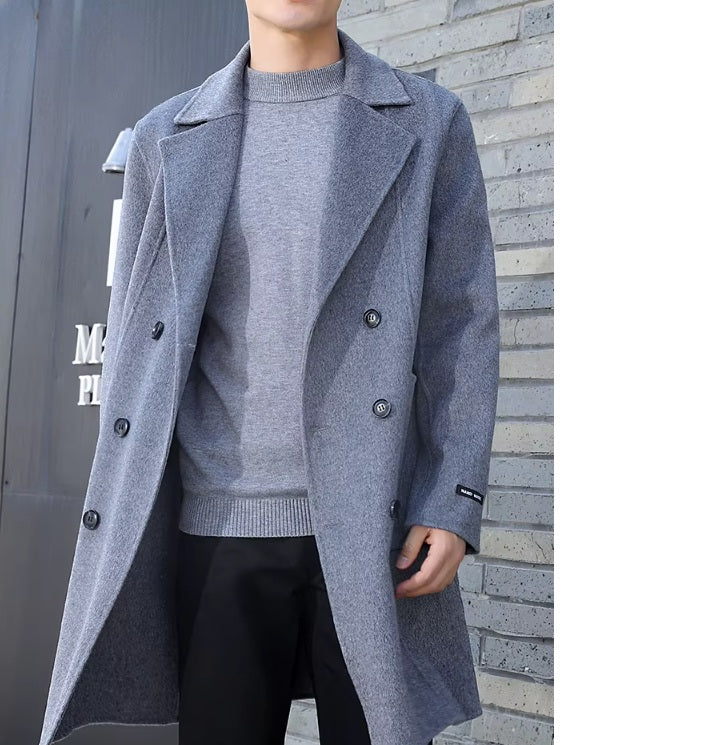 A model in motion wearing the Men’s Double-Sided Wool Coat in Comet, highlighting its structured fit and everyday versatility. From Borcelleclothes.