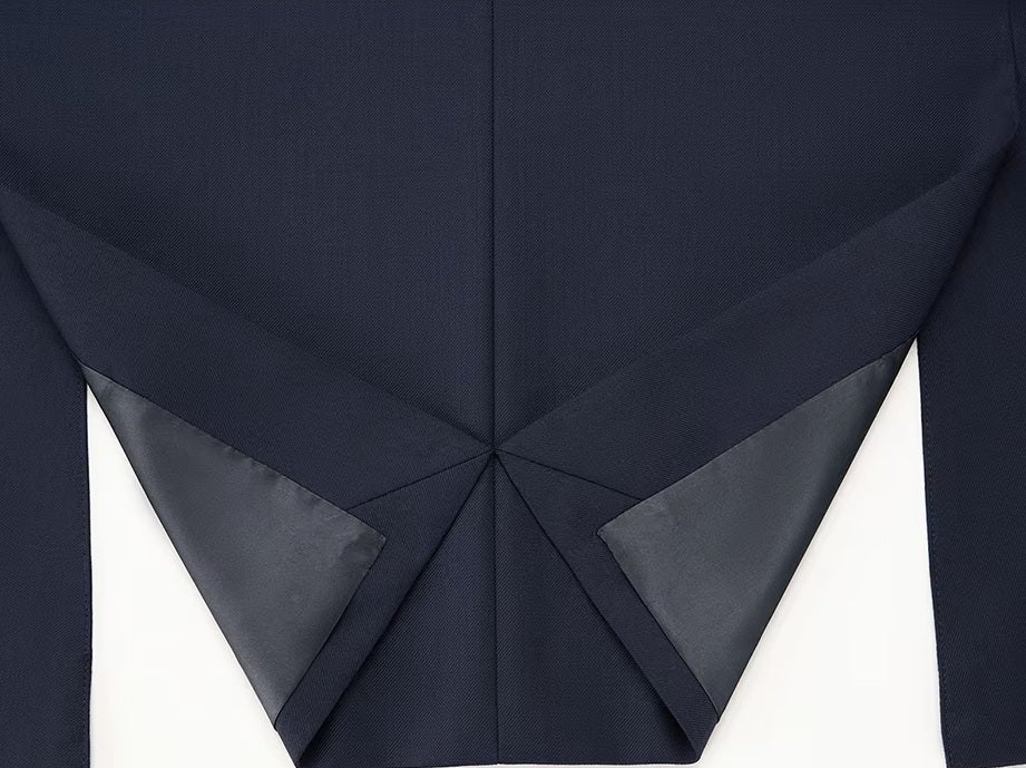 The back double vent on the blazer of the Borcelleclothes Men's Ebony Clay Business Suit, emphasizing mobility and polished design.