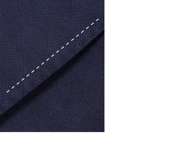 The straight stitching on the Borcelleclothes Men's Ebony Clay Suit with Bold Brass Accents, showcasing the precision of the tailoring.