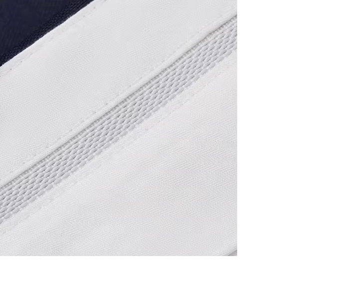 The gripper tape inside the waistband of the pants from the Borcelleclothes Men's Ebony Clay Suit with Bold Brass Accents, designed to keep shirts securely tucked.