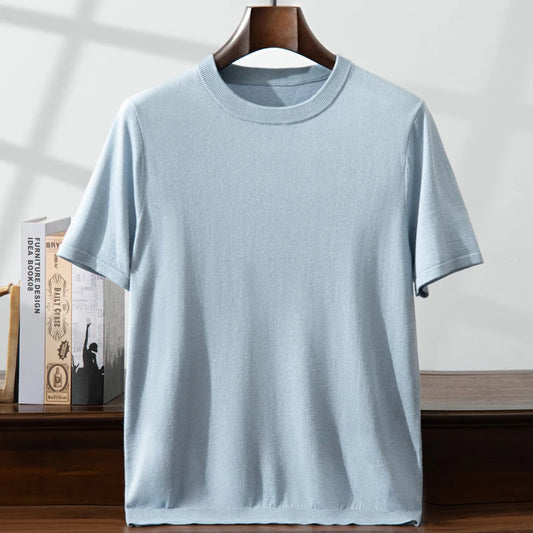 Men’s fine-knit silk-cashmere T-shirt in Jungle Mist, gently draped on a hanger to highlight the softness and light texture of the natural fibers. From Borcelleclothes.
