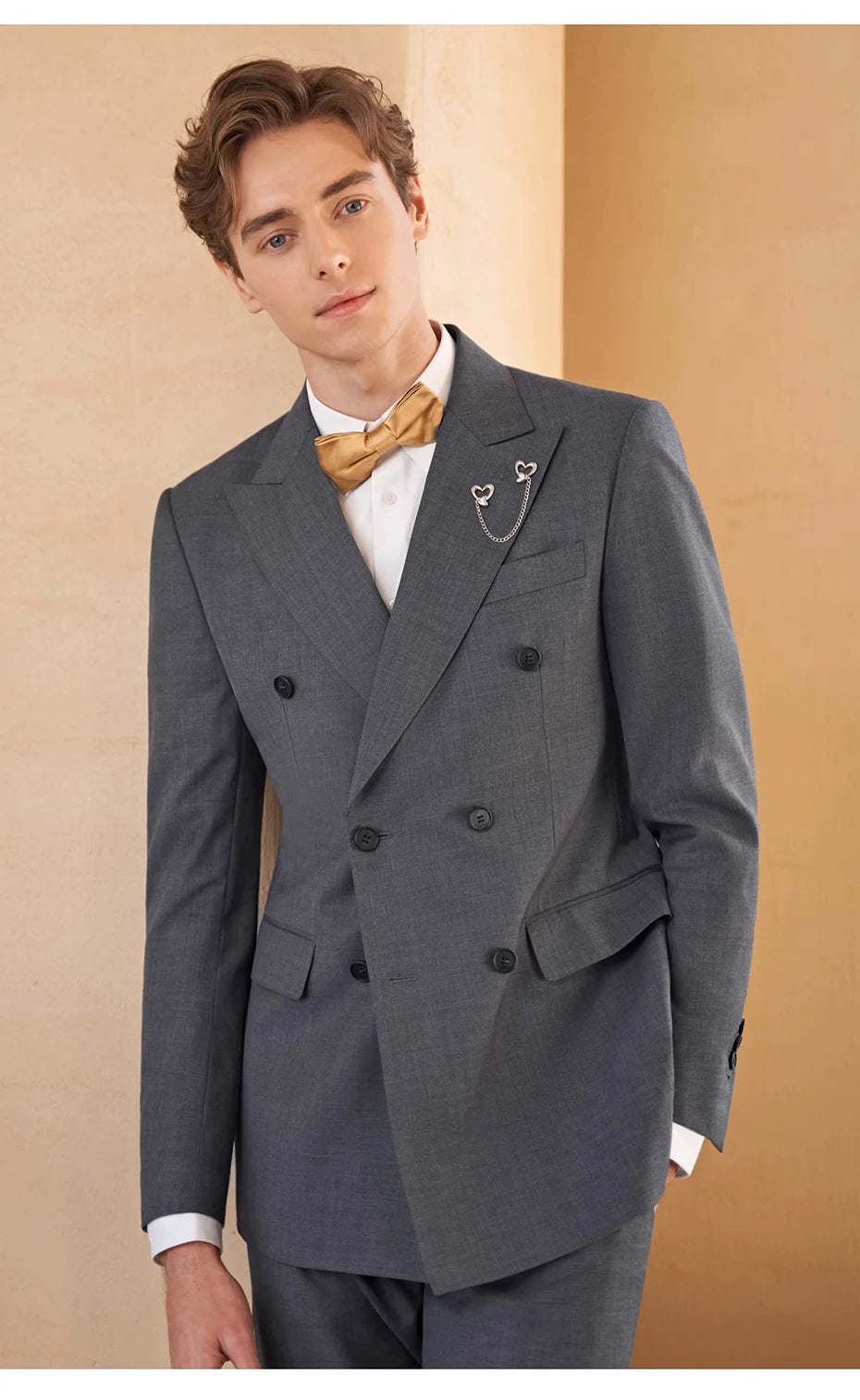 Men’s formal double-breasted wool suit in Davy Grey with peaked lapels and four-button sleeve plackets — structured, composed, and quietly commanding. From Borcelleclothes.