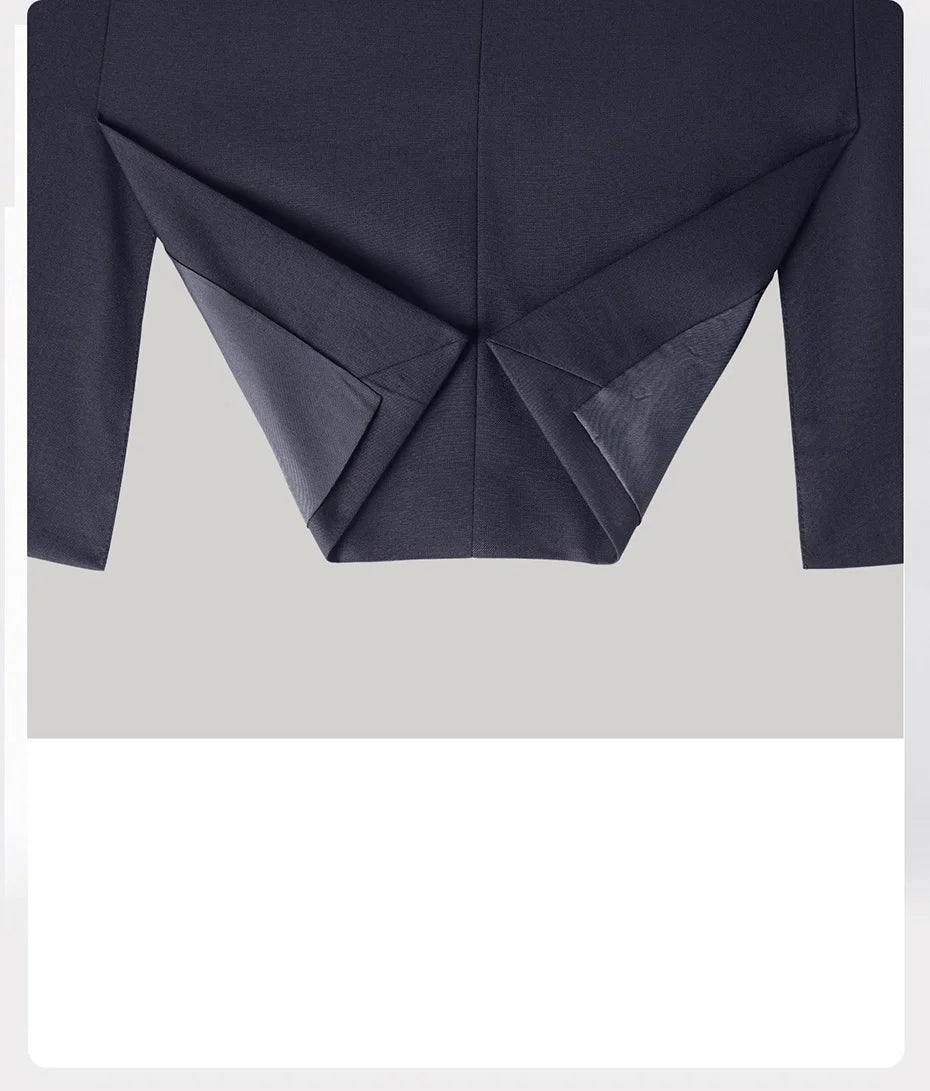 Unfolded hem of the blazer in Ebony Clay — control in motion, softness in structure. From Borcelleclothes.