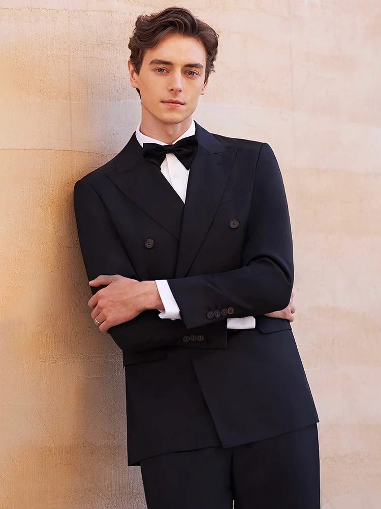 Ebony Clay suit worn with arms crossed — presence without words, form without force. From Borcelleclothes.