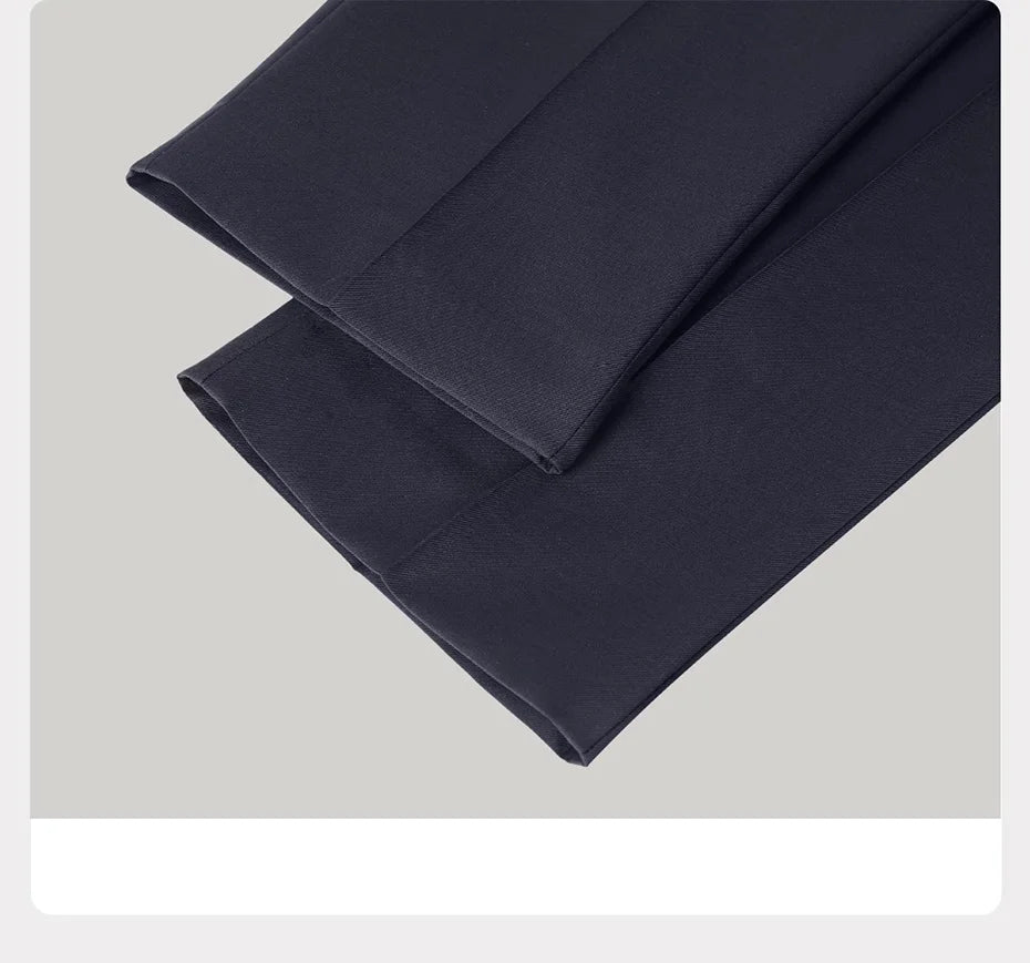 Straight hems of Ebony Clay trousers — clean lines, confident fall. From Borcelleclothes.