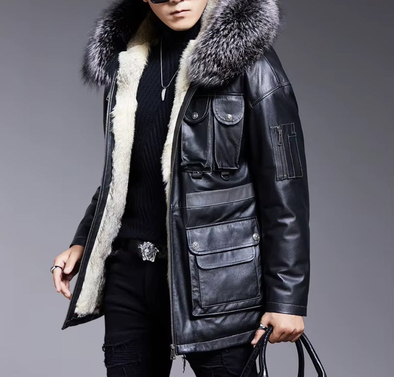 Model in Onyx cowhide leather jacket holding a bag, showing relaxed silhouette and functional styling. From Borcelleclothes.