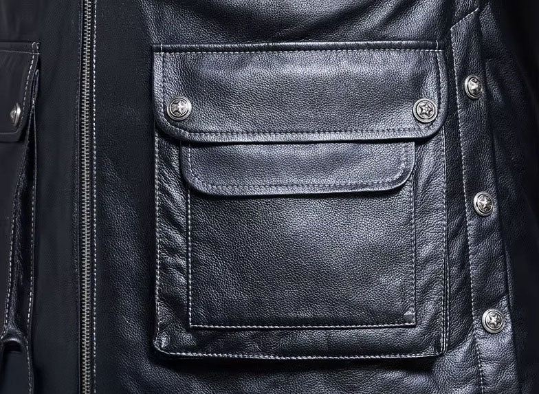 Close-up of right side cargo pocket with snapped flap on Onyx jacket, integrated into complex pocket layout. From Borcelleclothes,