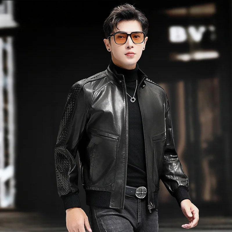 Model in motion wearing men’s goatskin jacket; woven sleeves and perforated yokes catch the light — From Borcelleclothes.