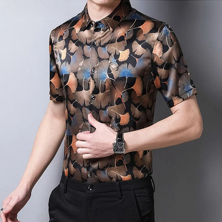 Model touching the front of the Ginkgo silk shirt, highlighting the organic leaf design and soft stretch of the fabric. From Borcelleclothes.