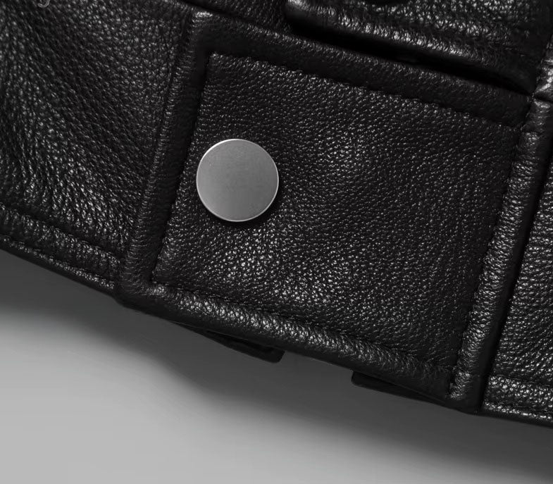 Bottom snap on the placket of the Onyx jacket; cleanly finished for streamlined front closure. From Borcelleclothes.