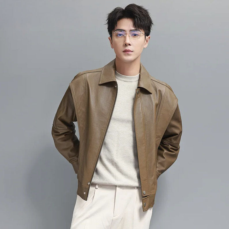 Model in Sandrift jacket with hands in pockets; demonstrates relaxed fit and layered structure in motion. From Borcelleclothes.