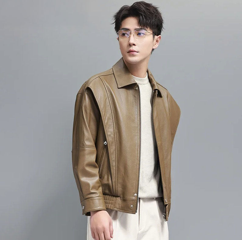 Model wearing the Sandrift goatskin leather jacket looking sideways; showcases front flaps and soft structure from a three-quarter angle. From Borcelleclothes.