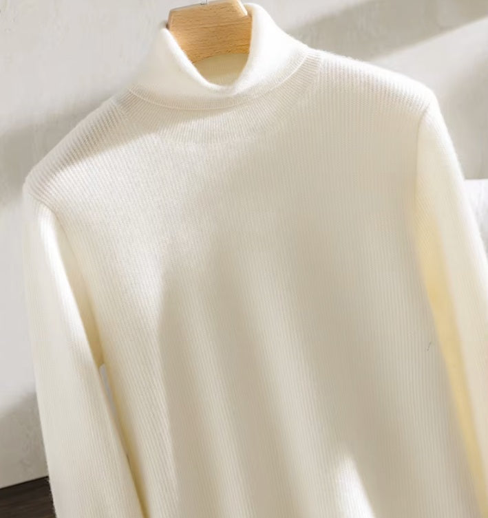 The upper part of the Men's Grade A Alashan Cashmere Turtleneck Sweater in Pearl Bush, featuring a luxurious zigzag texture and elegant turtleneck design. From Borcelleclothes.