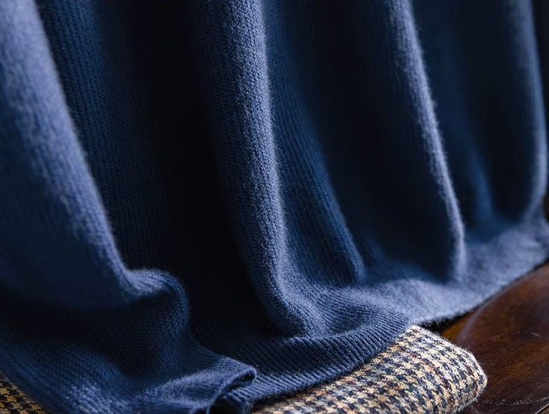 The ribbed bottom hem on the Men's Grade A Alashan Cashmere Turtleneck Sweater in Regal Blue, providing a clean and polished finish. From Borcelleclothes.