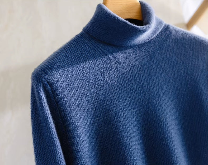 The upper part of the Men's Grade A Alashan Cashmere Turtleneck Sweater in Regal Blue, highlighting its turtleneck collar and zigzag texture. From Borcelleclothes.