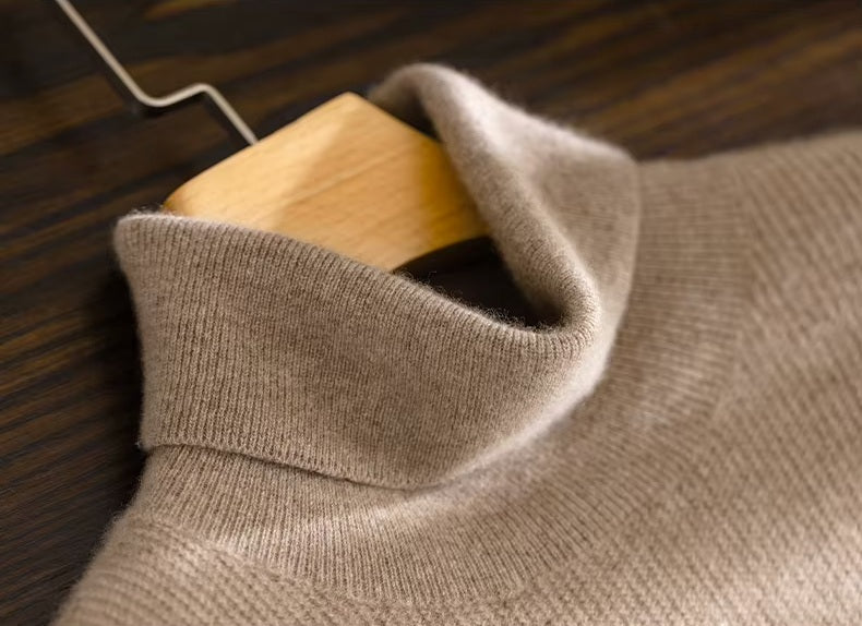 The turtleneck collar on the Men's Grade A Alashan Cashmere Turtleneck Sweater in Sandal, showcasing its intricate zigzag texture and tailored fit. From Borcelleclothes.