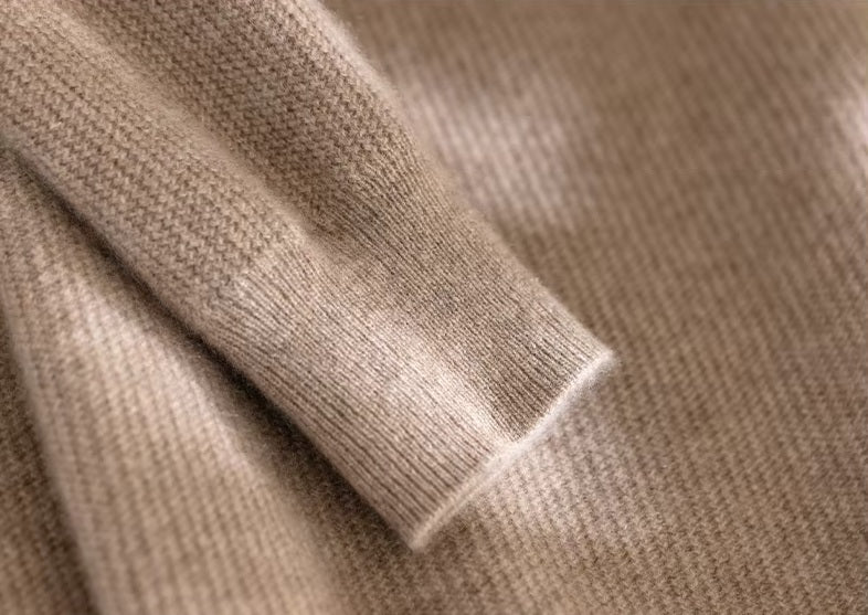 The ribbed sleeve hem on the Men's Grade A Alashan Cashmere Turtleneck Sweater in Sandal, emphasizing its refined craftsmanship. From Borcelleclothes.