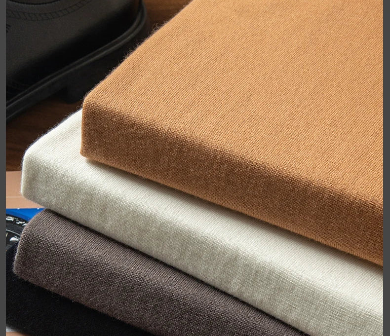 Stacked Grade A cashmere turtlenecks in Umber, French Beige, Onyx, and Platinum — From Borcelleclothes.
