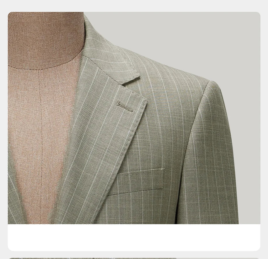 Close-up of the blazer’s left upper part, showing the notch lapel, horn button, and pinstripe texture. From Borcelleclothes.