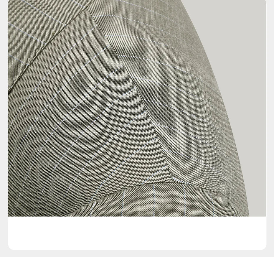 Detail of the blazer shoulder in the grey olive pinstripe suit, displaying the  structure. From Borcelleclothes.