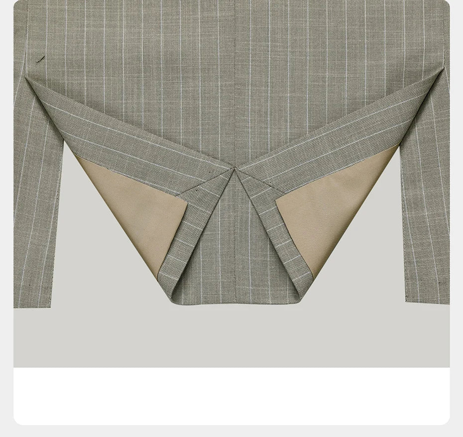 Blazer of the grey olive pinstripe suit laid flat to reveal the clean finish and construction of the hem. From Borcelleclothes.