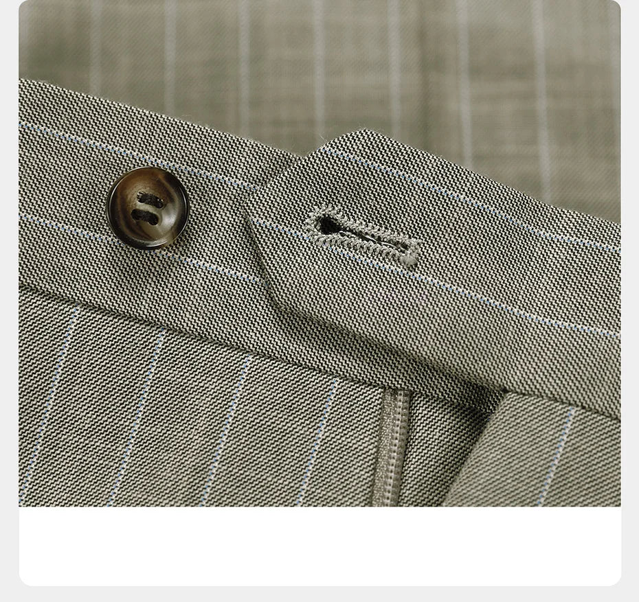 Grey olive pinstripe pants with horn button unfastened, revealing the waistband and interior finish. From Borcelleclothes.