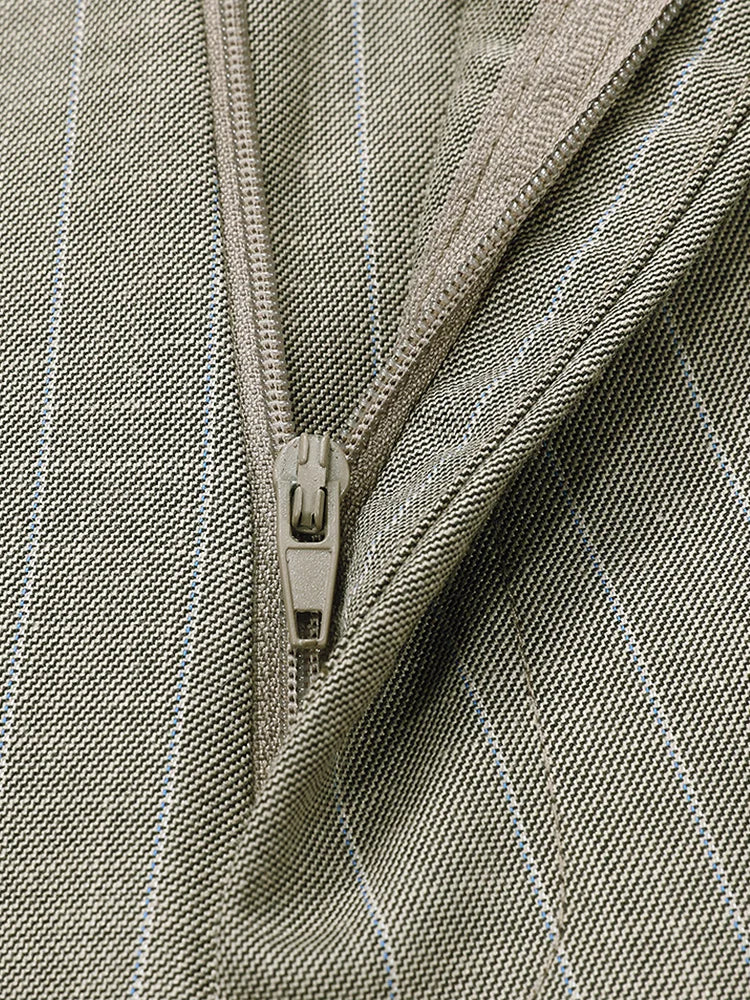 Detail of the pants’ front fly with the zipper partially open, showing inner construction. From Borcelleclothes.