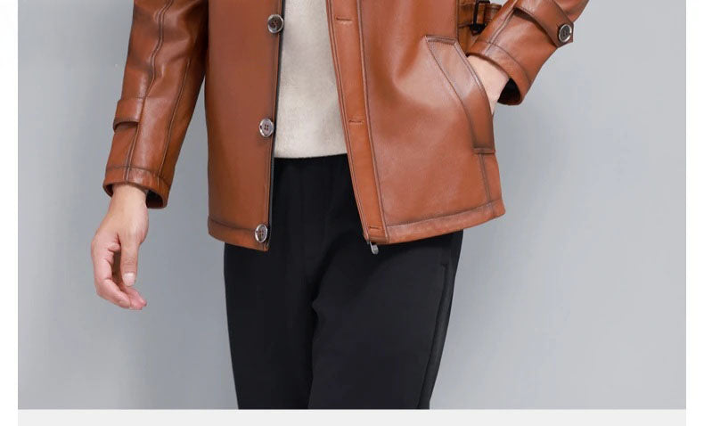 Men’s hooded cowhide leather jacket in Nutmeg — bottom section with side belts and ribbed hem. From Borcelleclothes.