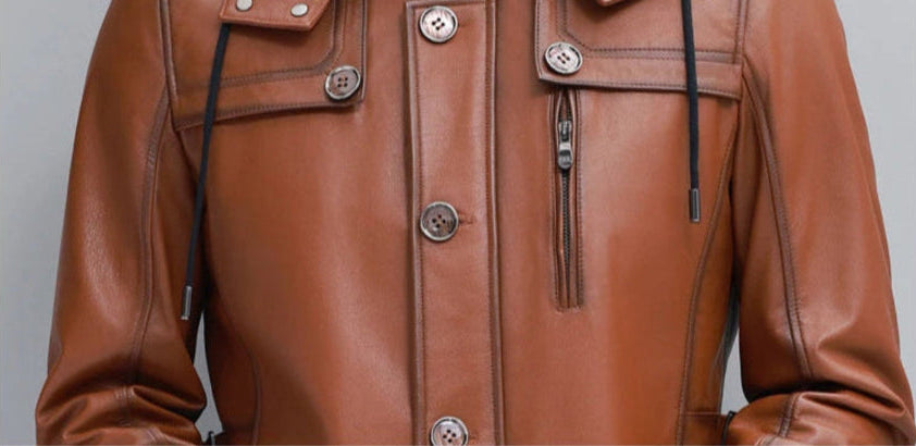 Men’s hooded cowhide leather jacket in Nutmeg — middle section showing chest zip pocket and buttoned placket. From Borcelleclothes.