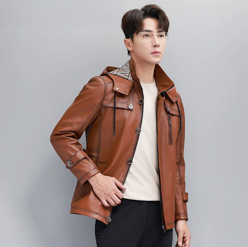 Men’s hooded cowhide leather jacket in Nutmeg — model turned slightly to the side, showing plaid-lined hood and structure. From Borcelleclothes.