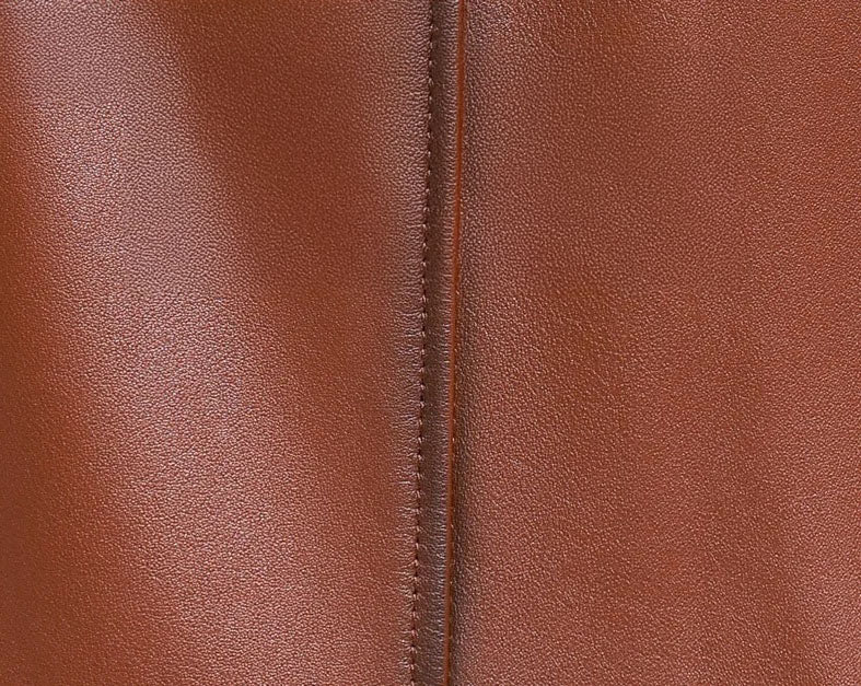 Men’s hooded cowhide leather jacket in Nutmeg — close-up of leather texture and stitching. From Borcelleclothes.