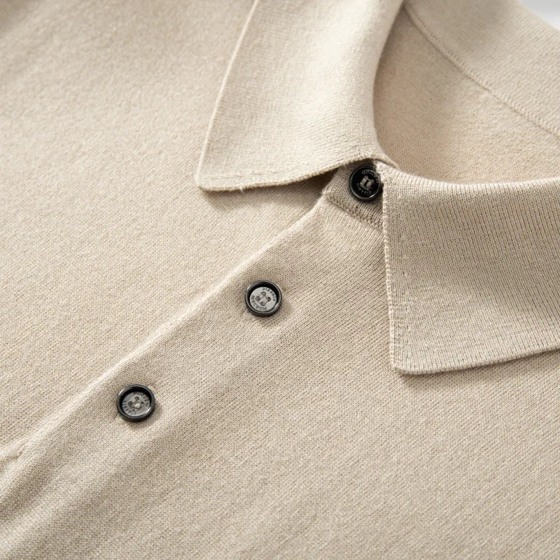 Detail of the Almond silk-cashmere polo — showing the open placket and wide collar resting fluidly. From Borcelleclothes.