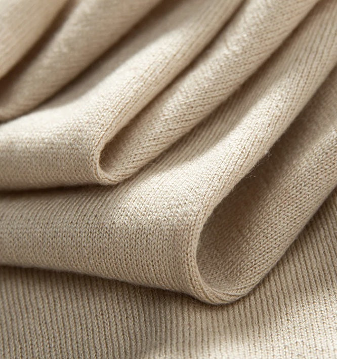 Folded fabric of the Almond polo — serpentine lines revealing the silk-cashmere blend’s fluidity and refined softness. From Borcelleclothes.