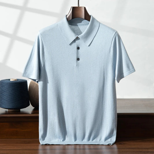 Men’s knitted silk-cashmere polo in Echo Blue — draped on a hanger, showcasing its elegant fall and softness. From Borcelleclothes.