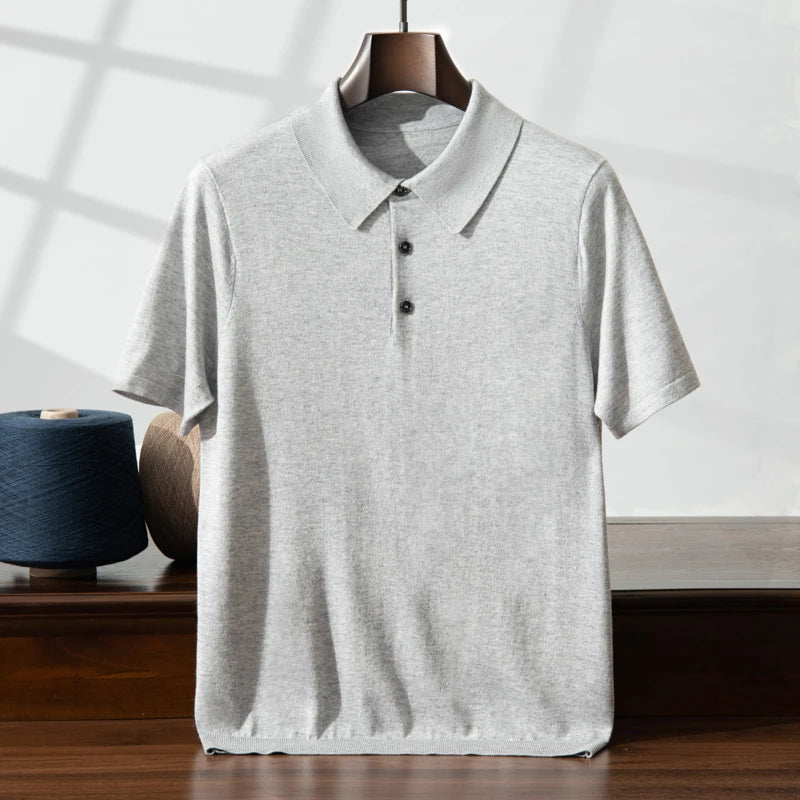 Men’s knitted silk-cashmere polo in Silver Sand — draped on a hanger, revealing the fabric’s light, fluid structure. From Borcelleclothes.