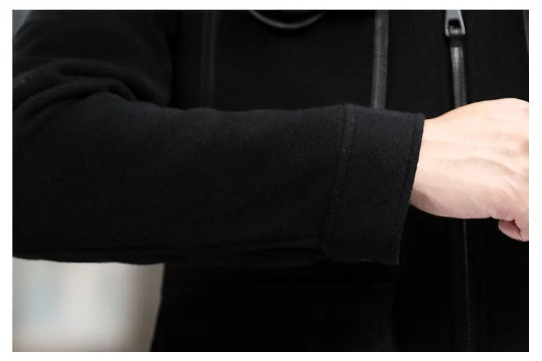 Onyx men’s leather-accented mini-coat cuff in matching fabric, maintaining cultivated clarity without leather. From Borcelleclothes.