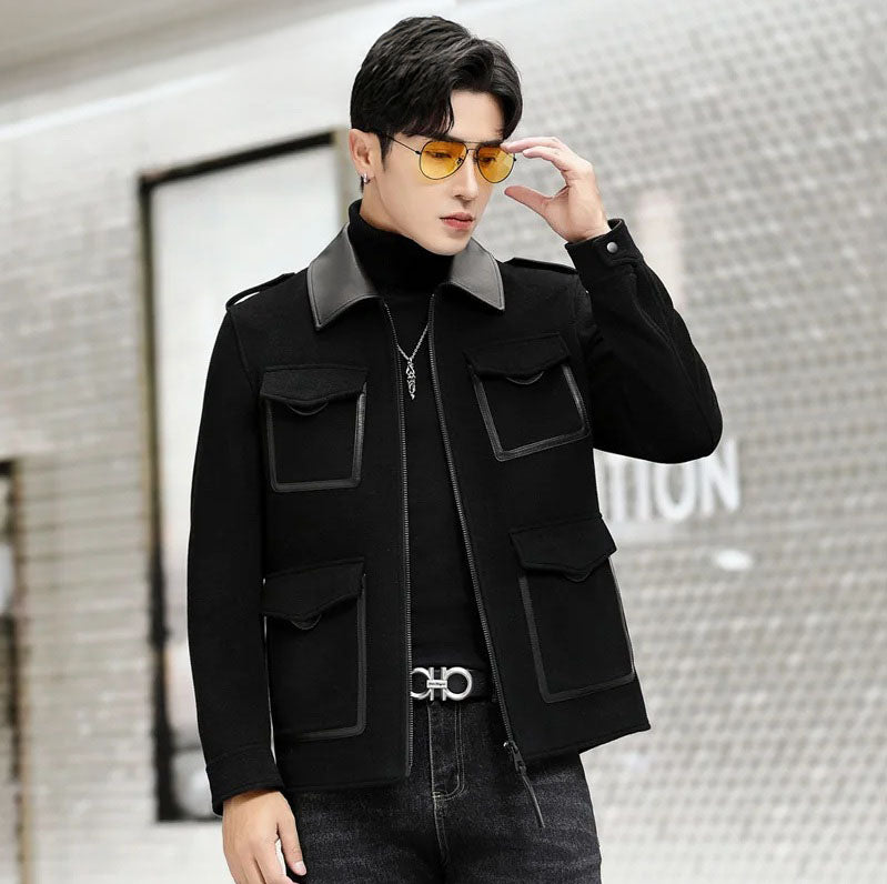 Onyx men’s leather-accented mini-coat, model adjusting glasses, showing refined tailoring and leather-trimmed details. From Borcelleclothes.